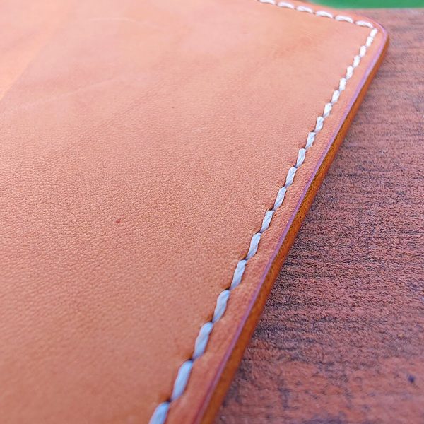 Close-up of the hand-stitched leather card holder