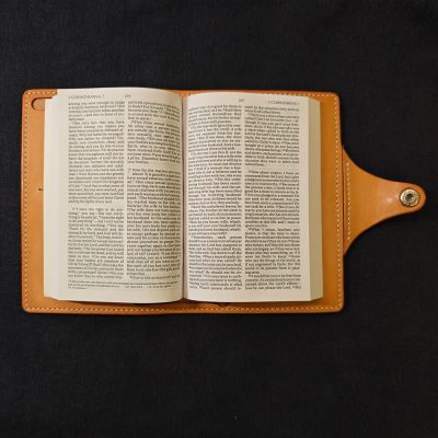 leather bible cover single closure black background bible